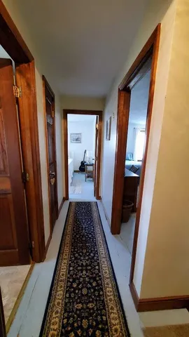 a living room with furniture ceiling fan and a window