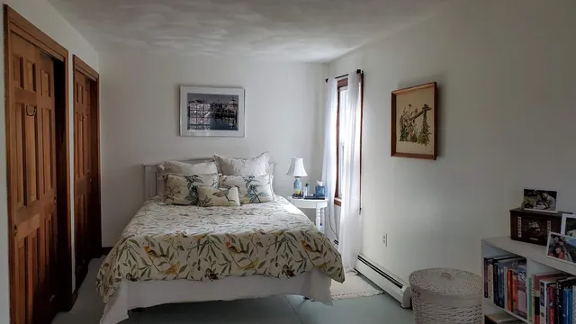 a view of a workspace with a bookshelf