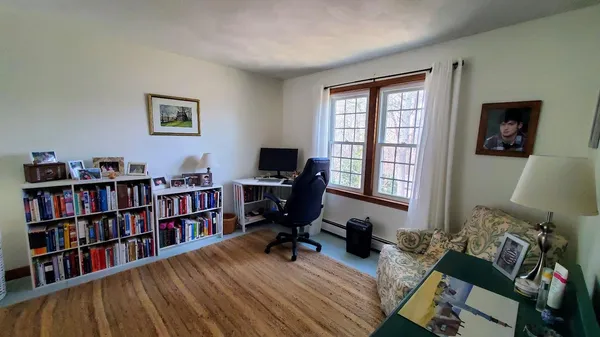 a bed room with a bed and a window