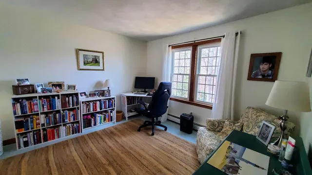 a bed room with a bed and a window