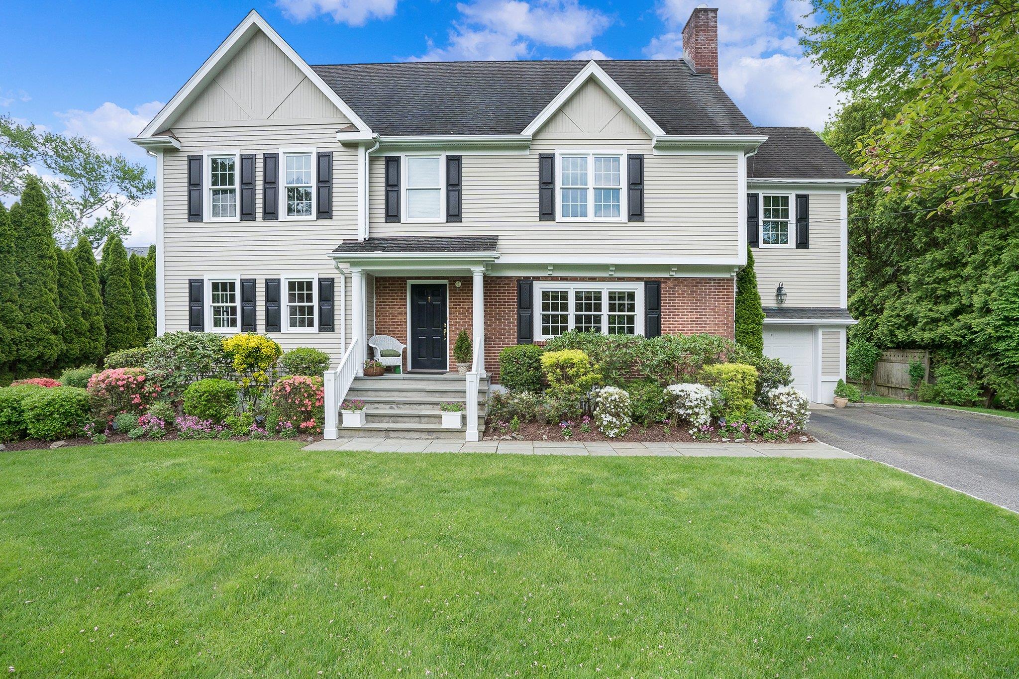 5 White Birch Drive Rye, NY 10580 - Photo 1 of 1 a front view of a house with a yard