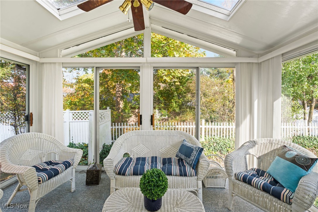 360 Sand Run Road Akron, OH 44313 - Photo 9 of 44 Three-Season Sun Room, featuring a cathedral ceiling with two skylights, is another upgrade.