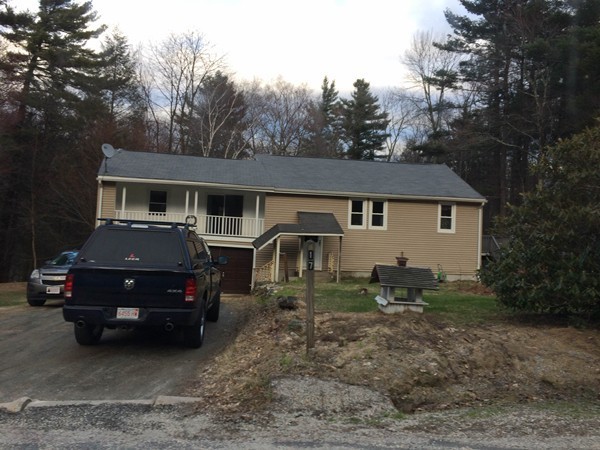 17 Searle Road Huntington, MA 01050 - Photo 1 of 19 a front view of a house with garden