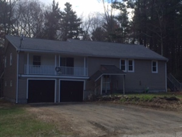 17 Searle Road Huntington, MA 01050 - Photo 2 of 19 a front view of a house with a garden
