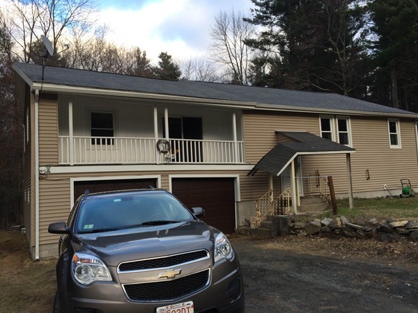 17 Searle Road Huntington, MA 01050 - Photo 3 of 19 a front view of a house with a yard