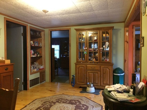 17 Searle Road Huntington, MA 01050 - Photo 10 of 19 a bedroom with a bed and wooden floor