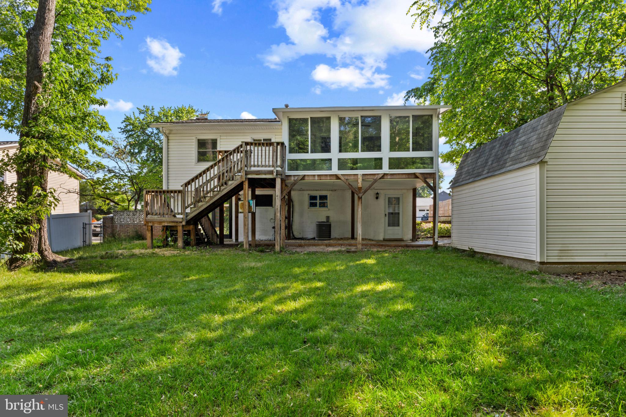 403 West Poplar Road Sterling, VA 20164 - Photo 22 of 25 Charming backyard retreat with deck.