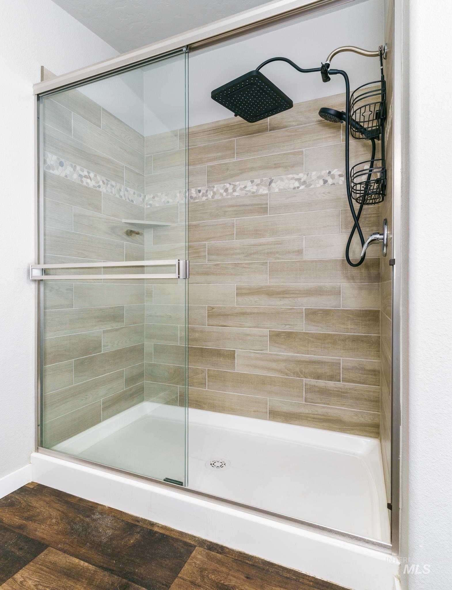 13678 North Hawthorne Road Pocatello, ID 83202 - Photo 23 of 37 Full bathroom with a stall shower and wood finished floors