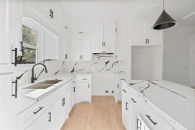 a bathroom with double vanity sink a mirror and vanity