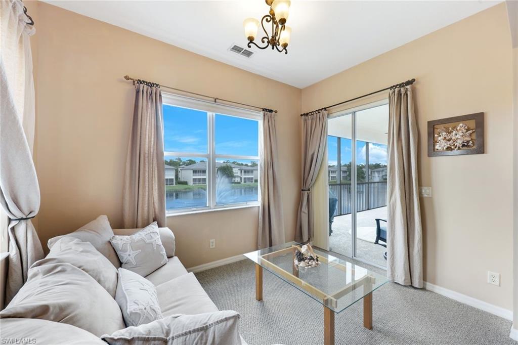 3530 Lansing Loop, Unit 202 Estero, FL 33928 - Photo 24 of 35 a living room with furniture and a window
