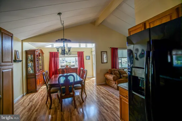 a room with large window and furniture