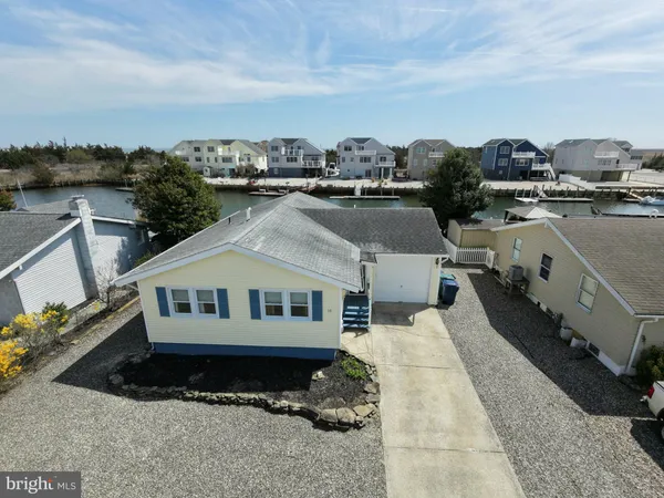an aerial view of a house with outdoor space