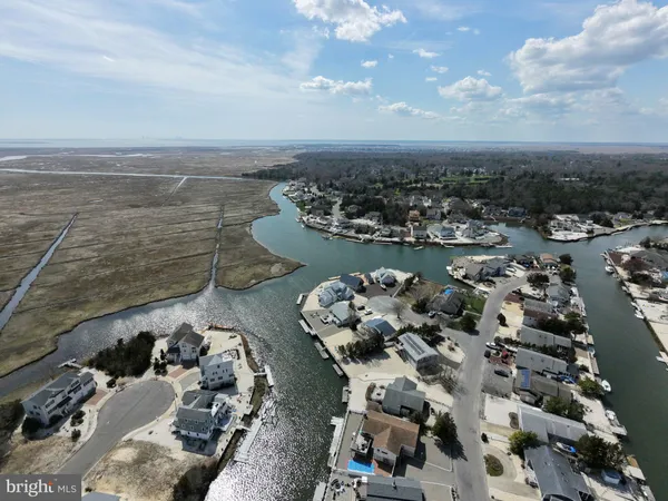 an aerial view of a city with ocean view