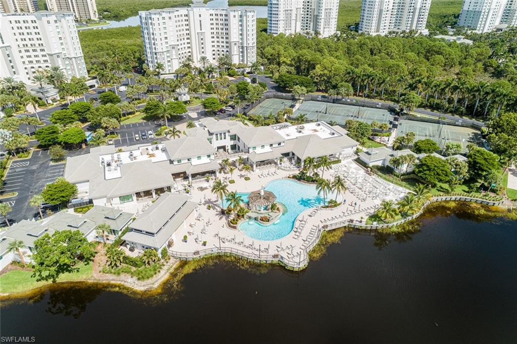 300 Dunes Boulevard, Unit 202 Naples, FL 34110 - Photo 2 of 24 a view of swimming pool and lake view