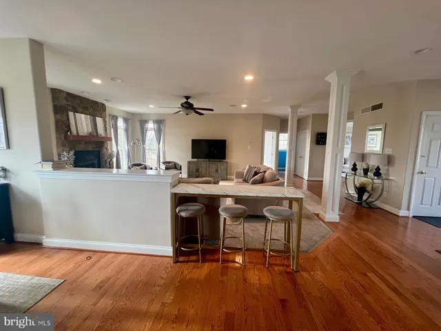 a view of kitchen with cabinets and wooden floor