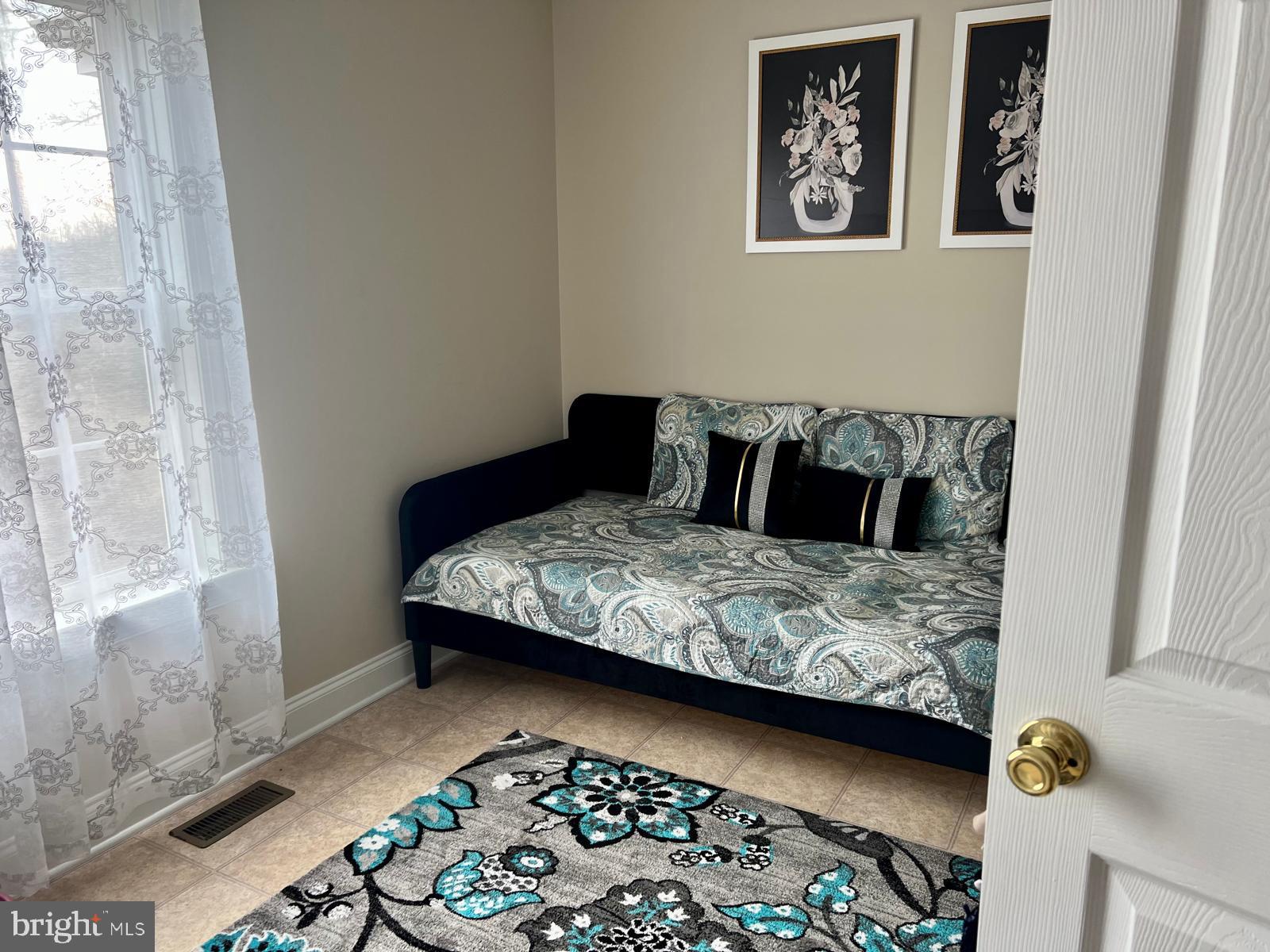 101 Richards Way Avondale, PA 19311 - Photo 22 of 45 a bedroom with a bed and a dresser next to a window