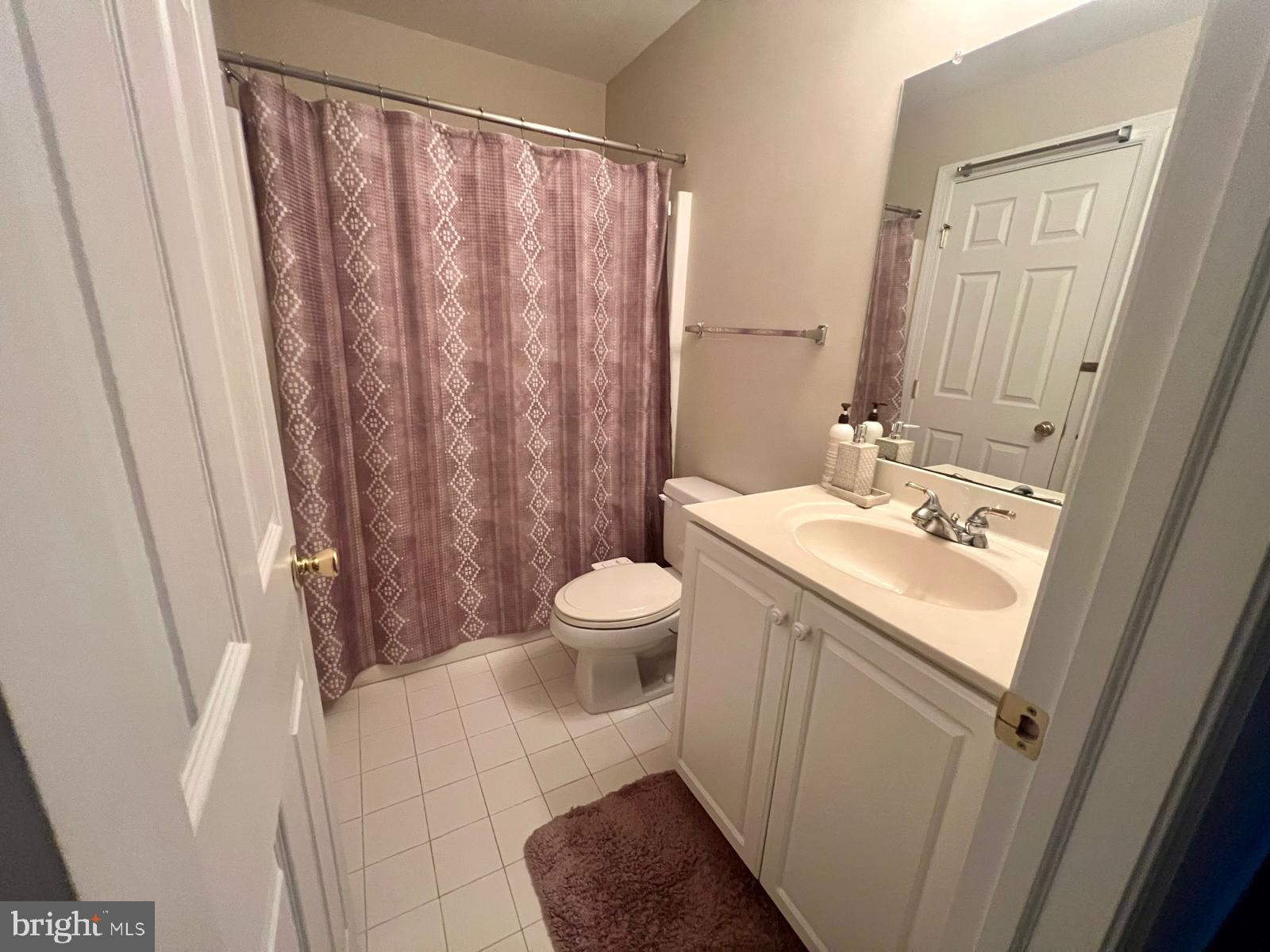 101 Richards Way Avondale, PA 19311 - Photo 34 of 45 a bathroom with a sink a toilet and shower curtain