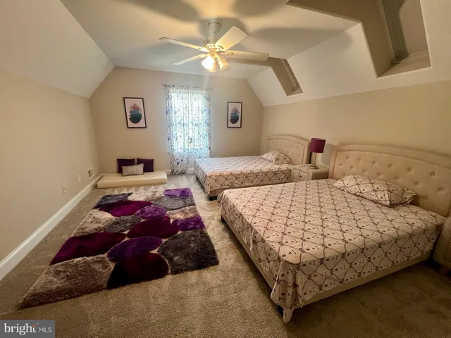 a bedroom with a bed and flowerpot