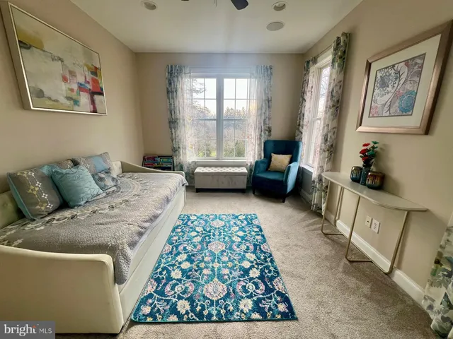 a bedroom with furniture and a window