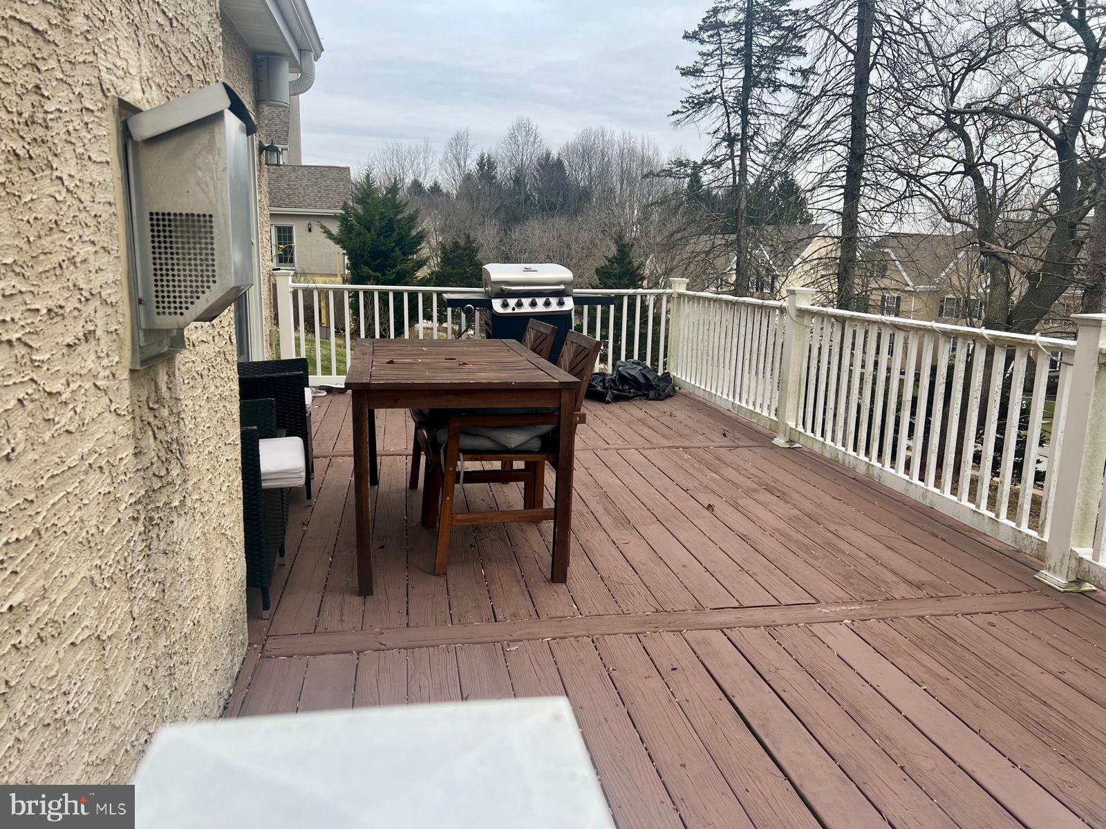 101 Richards Way Avondale, PA 19311 - Photo 44 of 45 a view of a roof deck with table and chairs and wooden floor