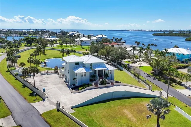 an aerial view of a house with a swimming pool
