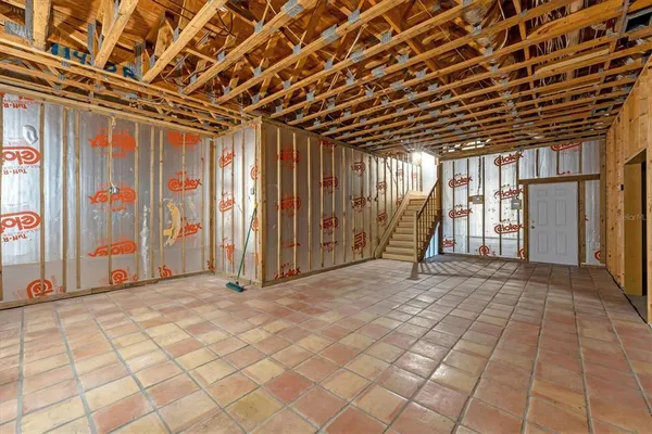 a view of an empty room with wooden walls