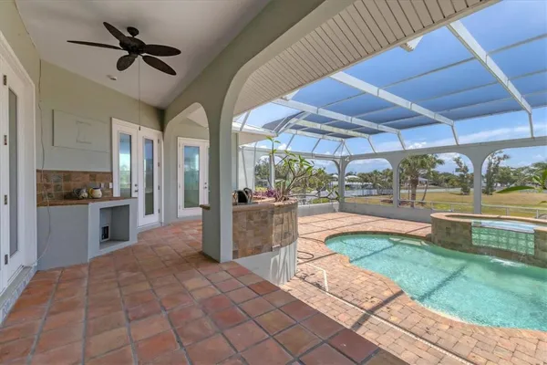 a view of a backyard with swimming pool
