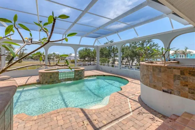 a view of a swimming pool with a patio