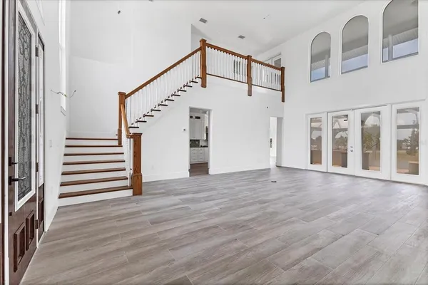 a view of an entryway with wooden floor