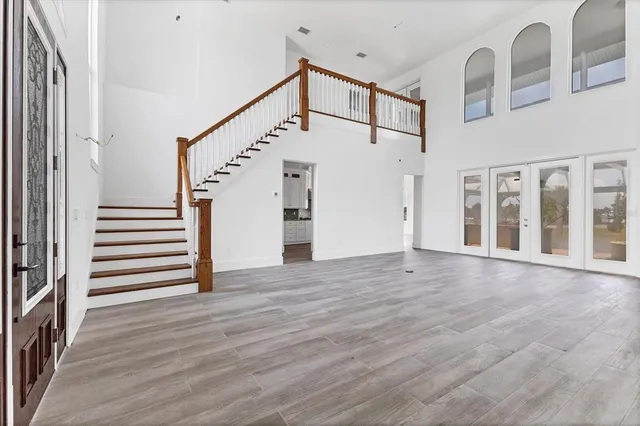 a view of an entryway with wooden floor