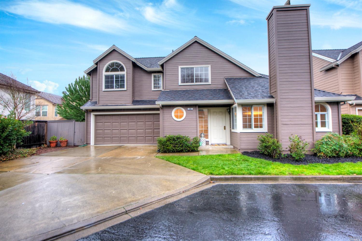 104 Ignacio Valley Circle Novato, CA 94949 - Photo 1 of 1 a front view of a house with a yard and garage