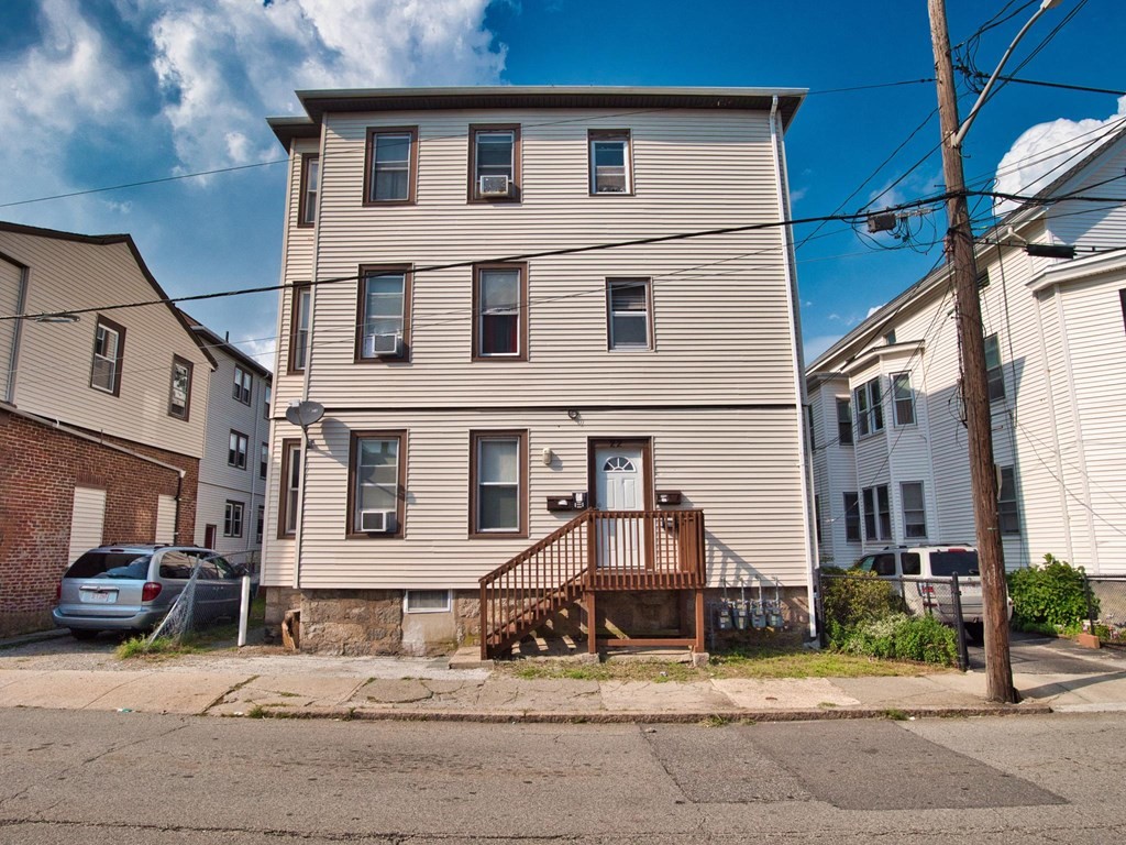 22 Lyon Street Fall River, MA 02721 - Photo 1 of 42 a view of a house with a patio
