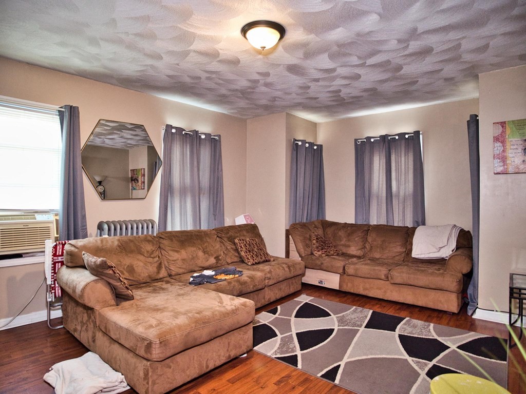 22 Lyon Street Fall River, MA 02721 - Photo 31 of 42 a living room with furniture and a large window