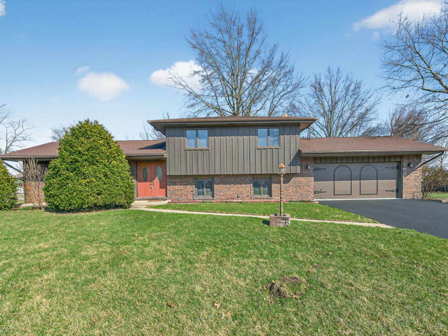 185 North Dewey Street Diamond, IL 60416 - Photo 1 of 39 a house that has a tree in front of it