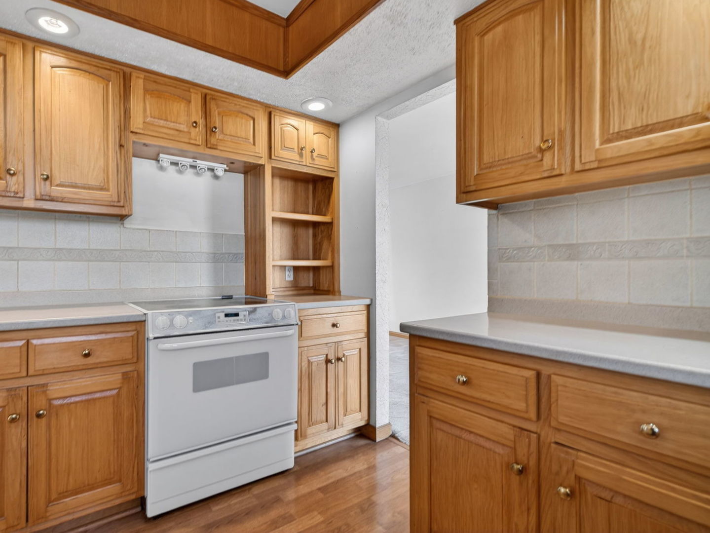 185 North Dewey Street Diamond, IL 60416 - Photo 12 of 39 a kitchen with granite countertop cabinets stainless steel appliances and a sink