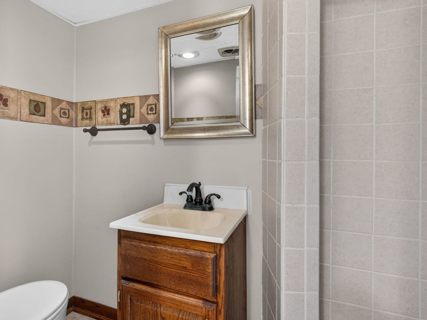 185 North Dewey Street Diamond, IL 60416 - Photo 31 of 39 a bathroom with a sink a toilet and mirror