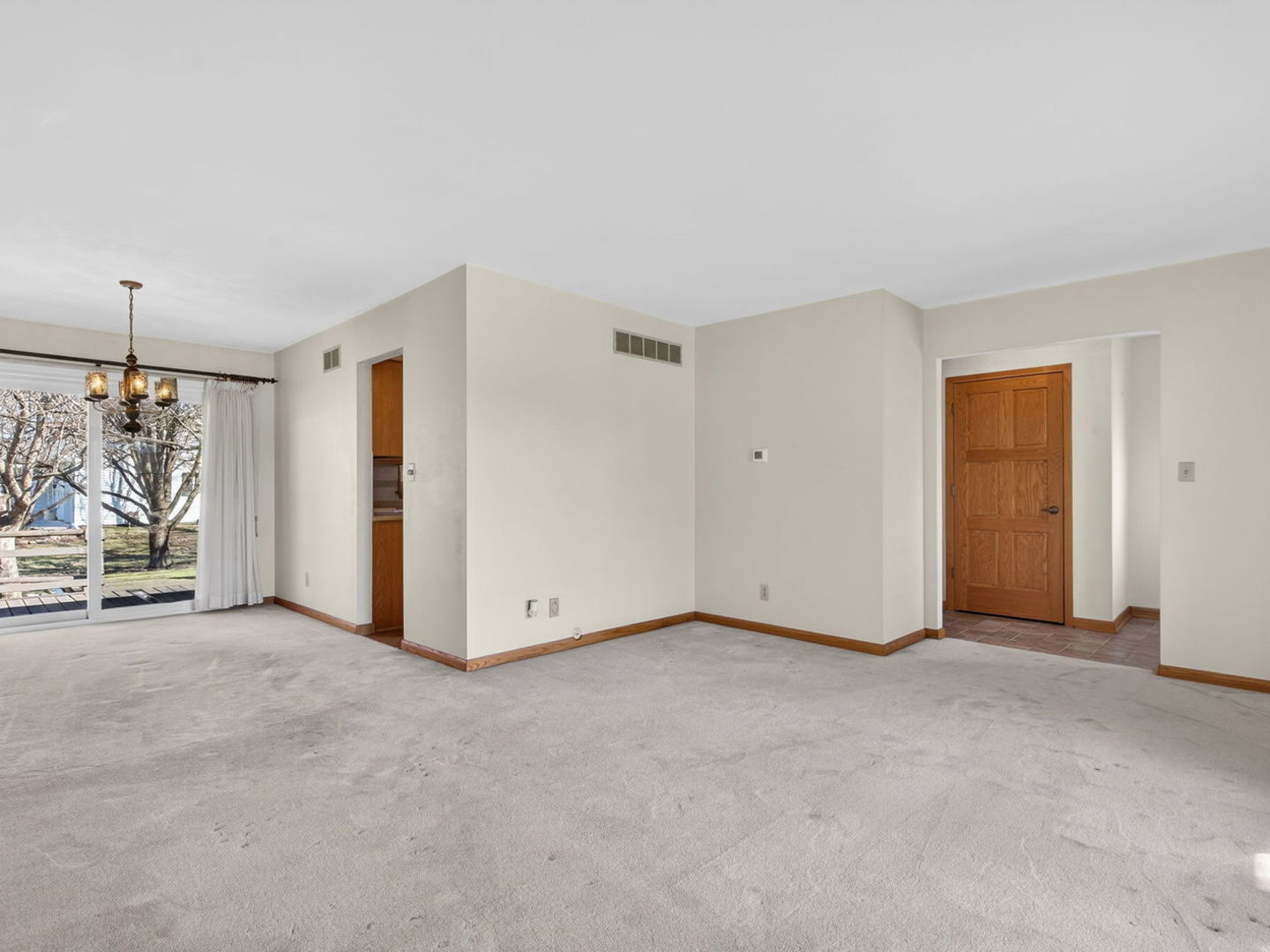 185 North Dewey Street Diamond, IL 60416 - Photo 7 of 39 a view of an empty room with a window