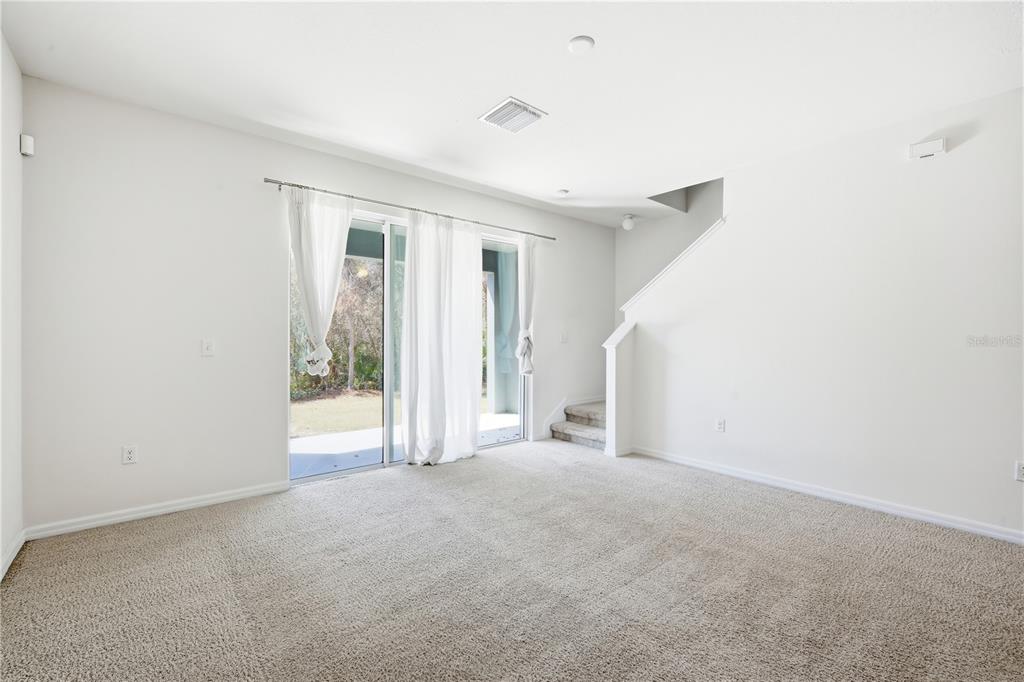 8986 Indigo Trail Loop Riverview, FL 33578 - Photo 11 of 28 a view of an empty room with a window