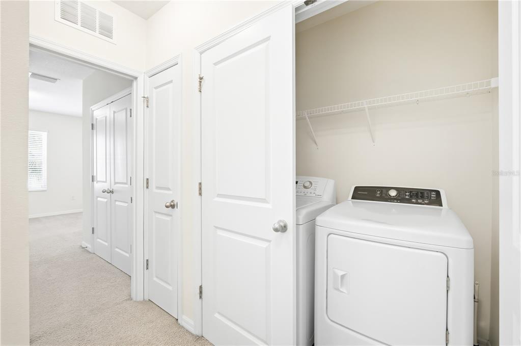 8986 Indigo Trail Loop Riverview, FL 33578 - Photo 18 of 28 a view of storage and utility room with washer and dryer