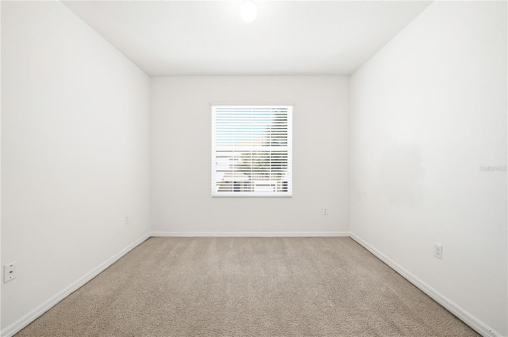 8986 Indigo Trail Loop Riverview, FL 33578 - Photo 20 of 28 an empty room with a window
