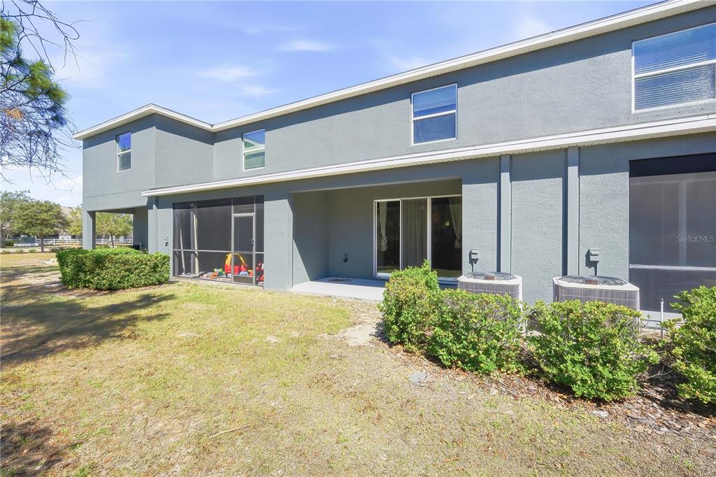 8986 Indigo Trail Loop Riverview, FL 33578 - Photo 22 of 28 front view of a house with a yard
