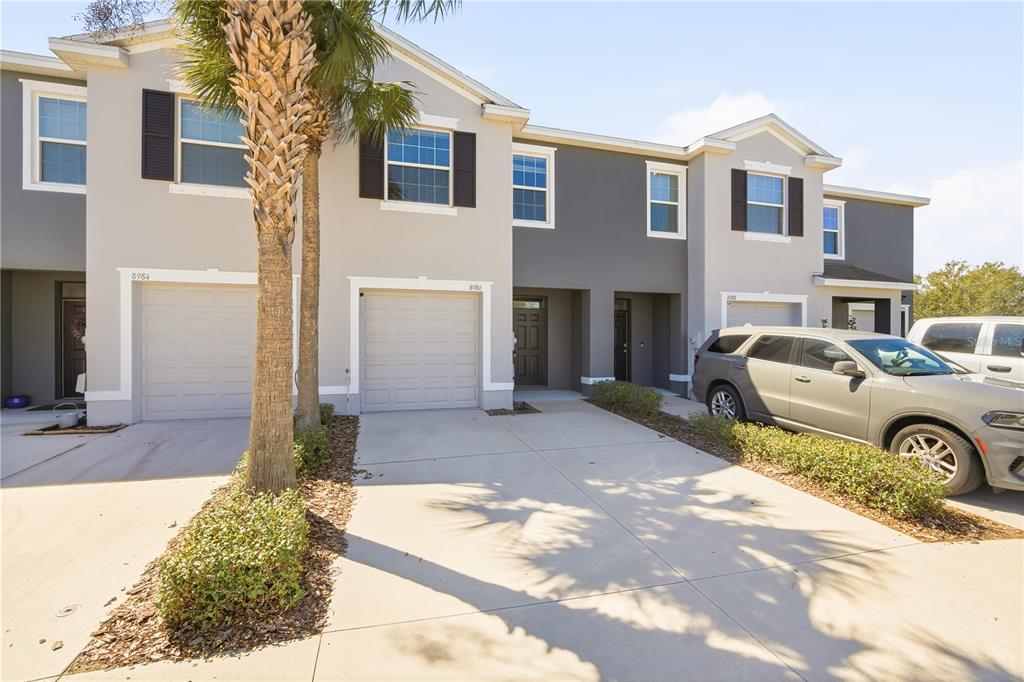 8986 Indigo Trail Loop Riverview, FL 33578 - Photo 3 of 28 a front view of a house with garden