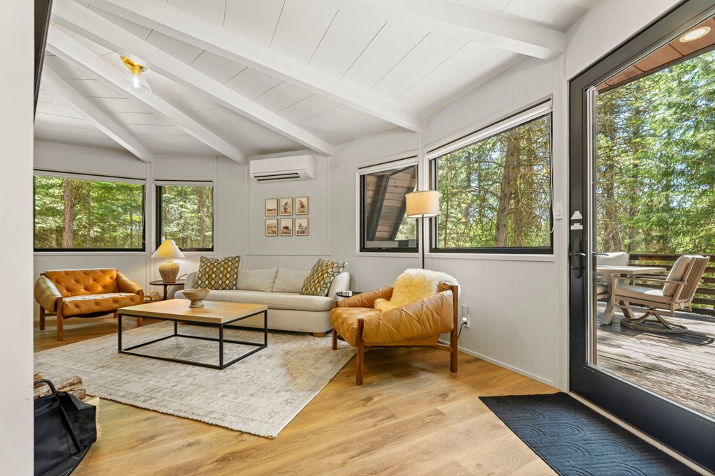 501 Gamble Road McCall, ID 83638 - Photo 6 of 28 Living Room, The living room opens to a spacious deck that has views of the Payette River and the sounds of the running river.