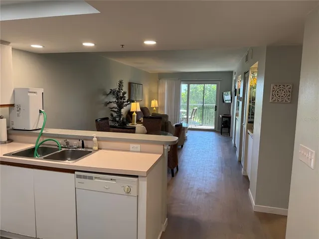a kitchen with a sink and a refrigerator