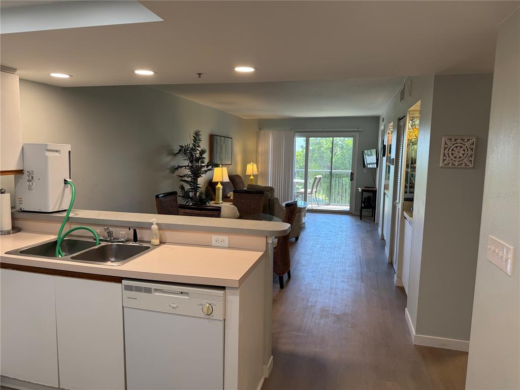 2320 Terra Ceia Bay Boulevard, Unit 404 Palmetto, FL 34221 - Photo 2 of 12 a kitchen with a sink and a refrigerator