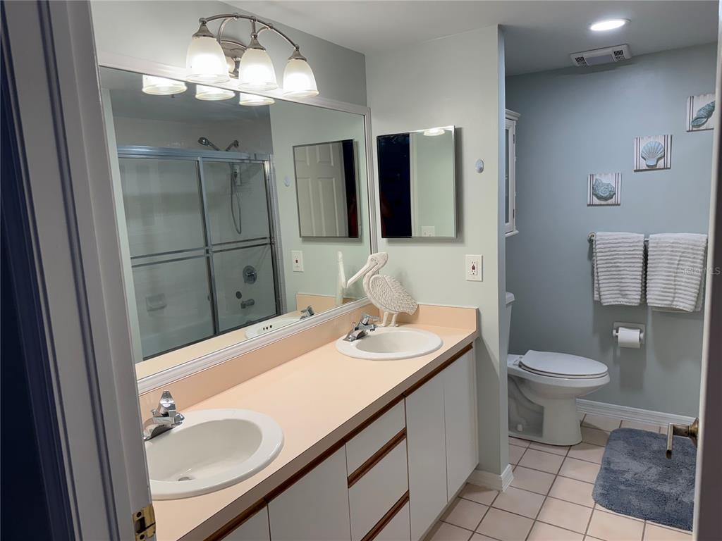 2320 Terra Ceia Bay Boulevard, Unit 404 Palmetto, FL 34221 - Photo 6 of 12 a bathroom with a sink toilet and shower