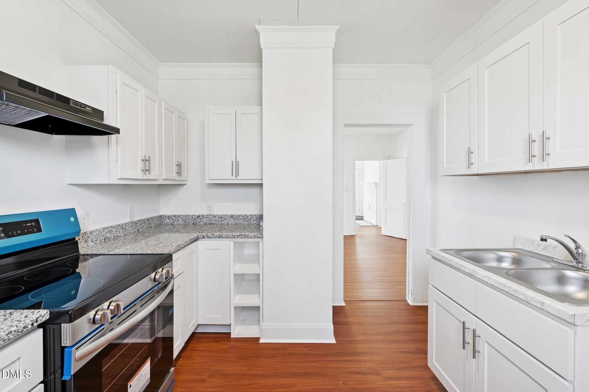 705 North Driver Street Durham, NC 27703 - Photo 20 of 46 a kitchen with a sink and a stove top oven
