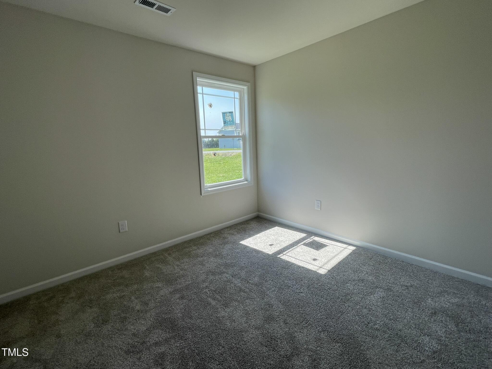 261 Phil Jack Road Dunn, NC 28334 - Photo 10 of 18 an empty room with a window