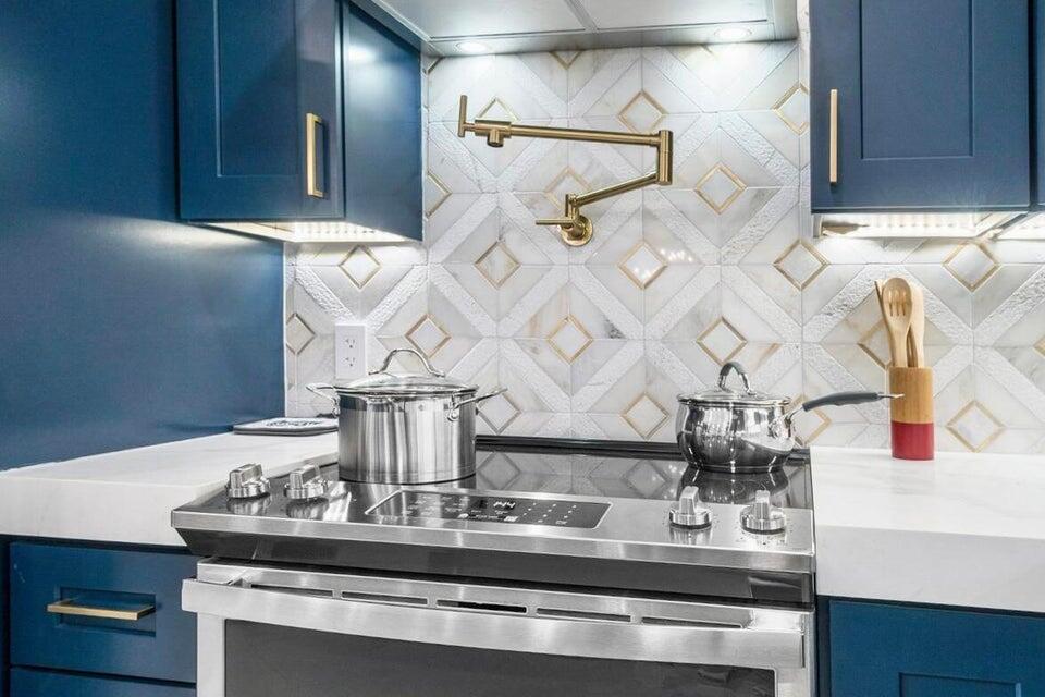 324 Bamboo Road Palm Beach Shores, FL 33404 - Photo 16 of 59 a view of kitchen with a sink and chandelier