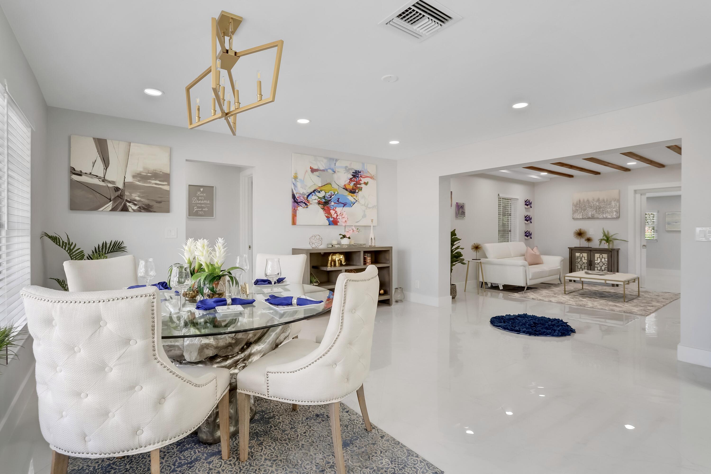 324 Bamboo Road Palm Beach Shores, FL 33404 - Photo 35 of 59 a dining room with furniture and a kitchen view